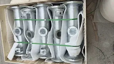 To protect ceramic cylinder liner bends from long-term exposure to highly corrosive and abrasive media, which fittings are suitable?